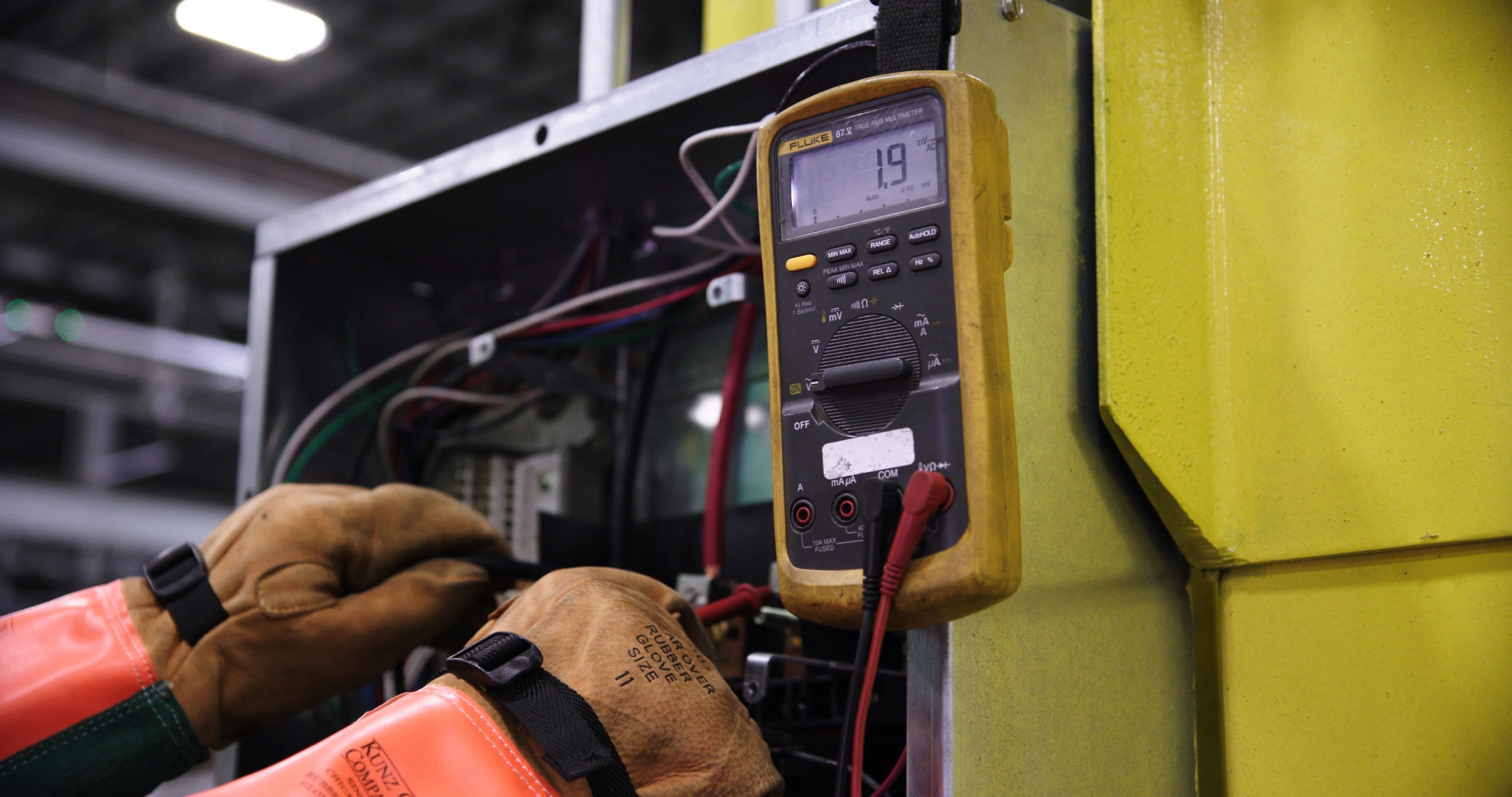 Electrical technician diagnosing an electrical fault